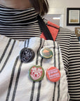 A little dark humor for your jacket, bag, or wherever you pin your personality. 'All Men Are Cremated Equal' — a reminder that in the end, the flames don't play favorites. Pin it loud, pin it proud.