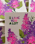 Card with 'I Lilac You A Lot' text surrounded by lilac flower illustrations.