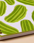 Dreams do come true, especially when they involve pickles. This snack-inspired spiral notebook features quirky illustrated pickles on a letterpress printed cover and 48 lined pages inside. It's the perfect size to carry your notes, lists, ideas, or secret snack plans. 
