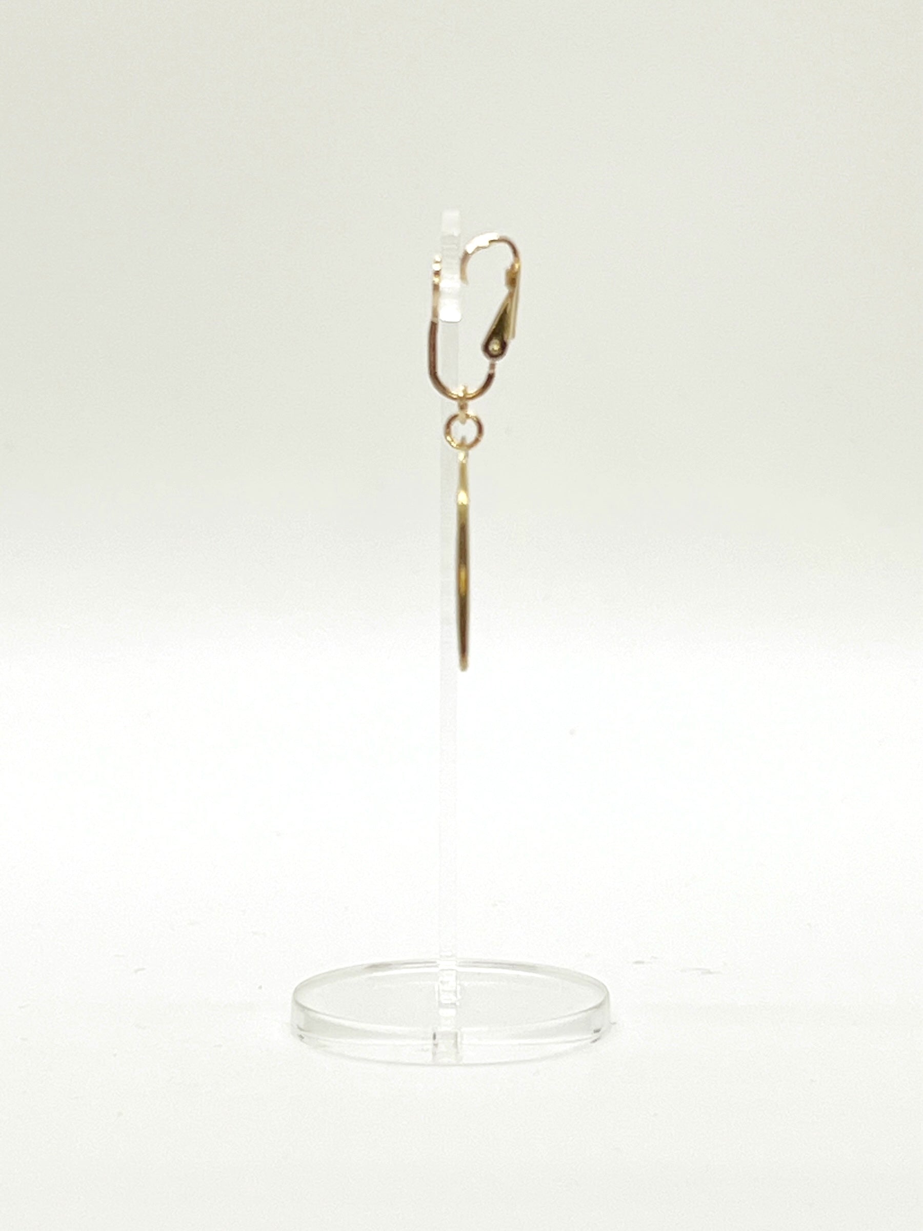 This Adaptive Add-On converts your Son of a Sailor earrings into easy-to-wear clip-ons. It's perfect for those without pierced ears, those with sensitive or stretched earlobes, or anyone who finds traditional earwires challenging. Available in sterling silver or 14k gold-filled, it offers a comfortable, accessible fit without sacrificing style.