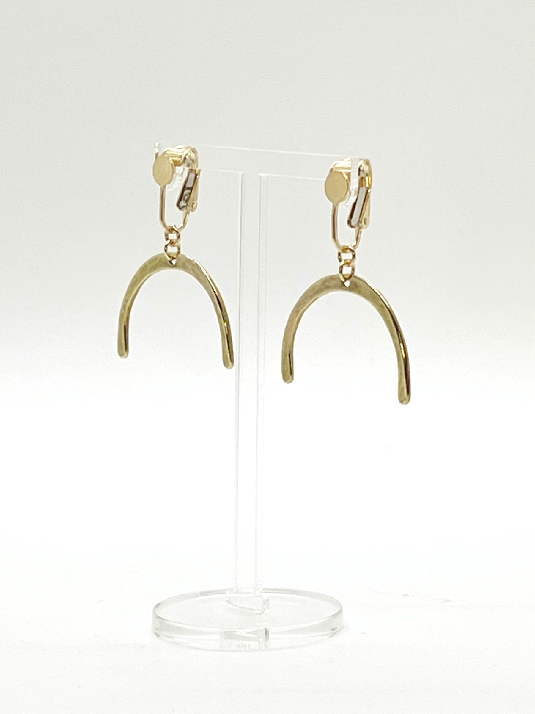 This Adaptive Add-On converts your Son of a Sailor earrings into easy-to-wear clip-ons. It's perfect for those without pierced ears, those with sensitive or stretched earlobes, or anyone who finds traditional earwires challenging. Available in sterling silver or 14k gold-filled, it offers a comfortable, accessible fit without sacrificing style.