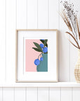 Bring color to your walls with this vibrant blueberry bouquet print! A bold pink background and modern style add cheerful energy to any space.