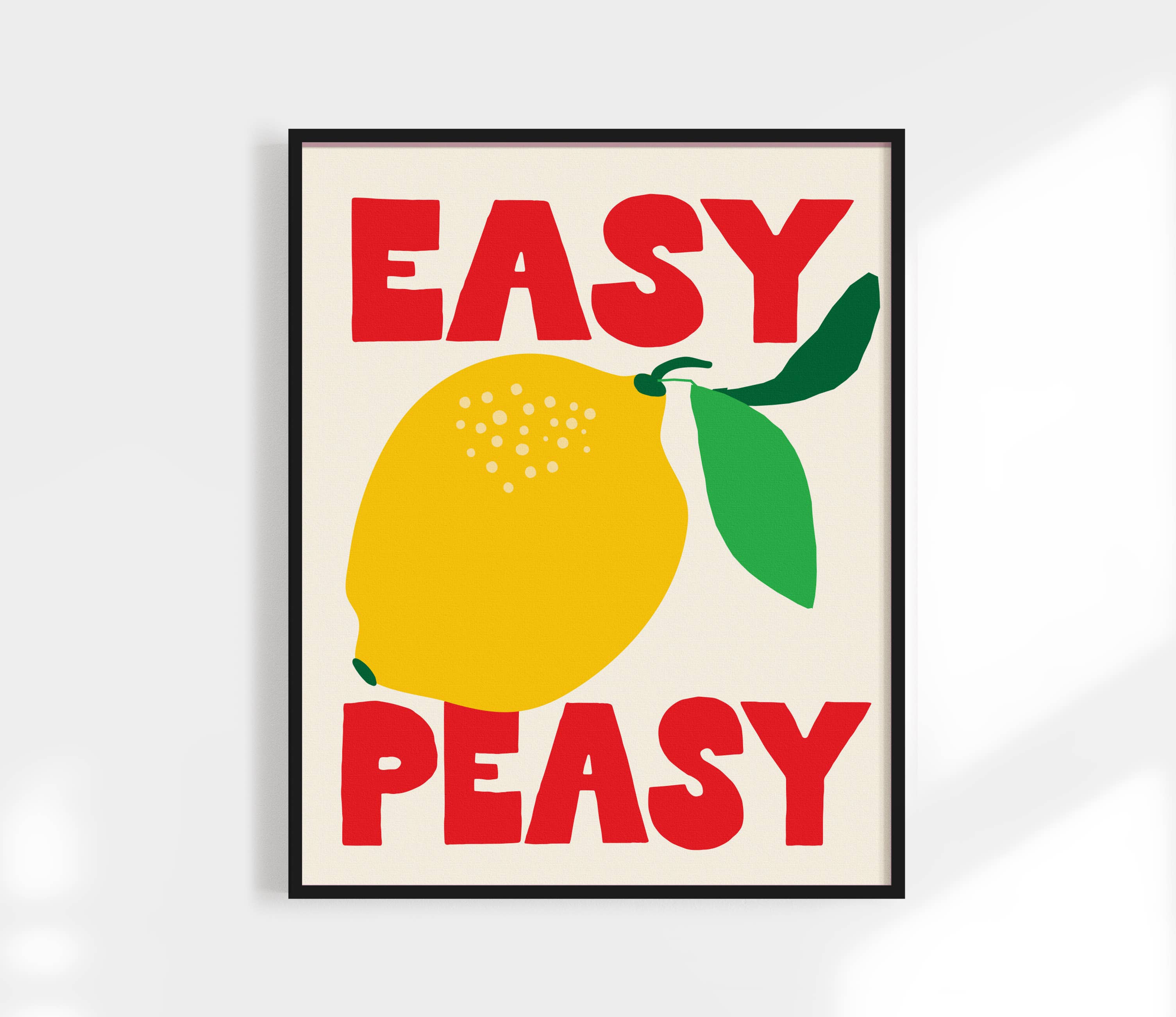 Add a splash of playful charm to your space with the Easy Peasy Lemon Squeezy Art Print by Kuku Studio. Featuring bold hand-drawn lettering and vibrant illustrations of lemons, this design pops in bright red, green, and yellow on a clean neutral background. Printed on luxe, giclée-quality matte paper, each print is designed and produced in Kuku Studio’s San Diego home studio.