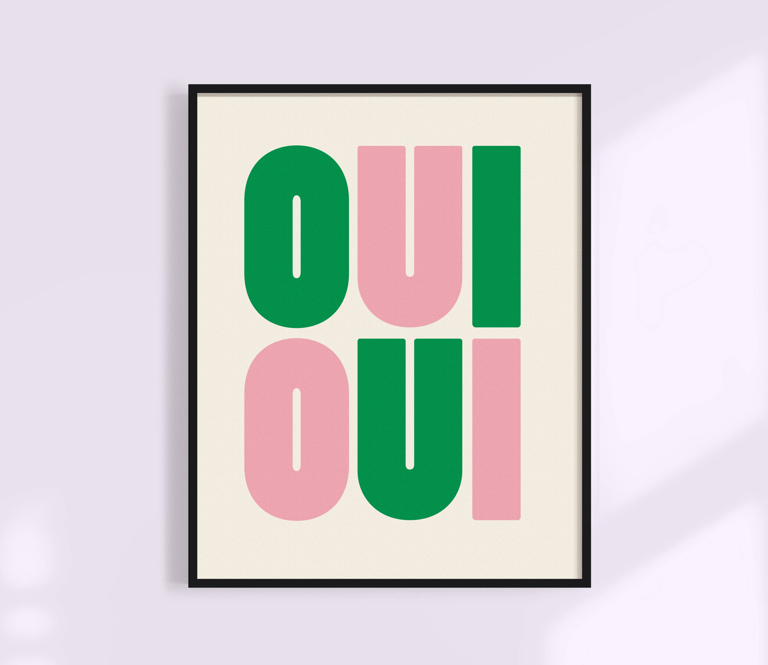 Say it twice with this bold Oui Oui art print. Pink and green text on a clean neutral background adds playful charm to any bathroom or gallery wall.