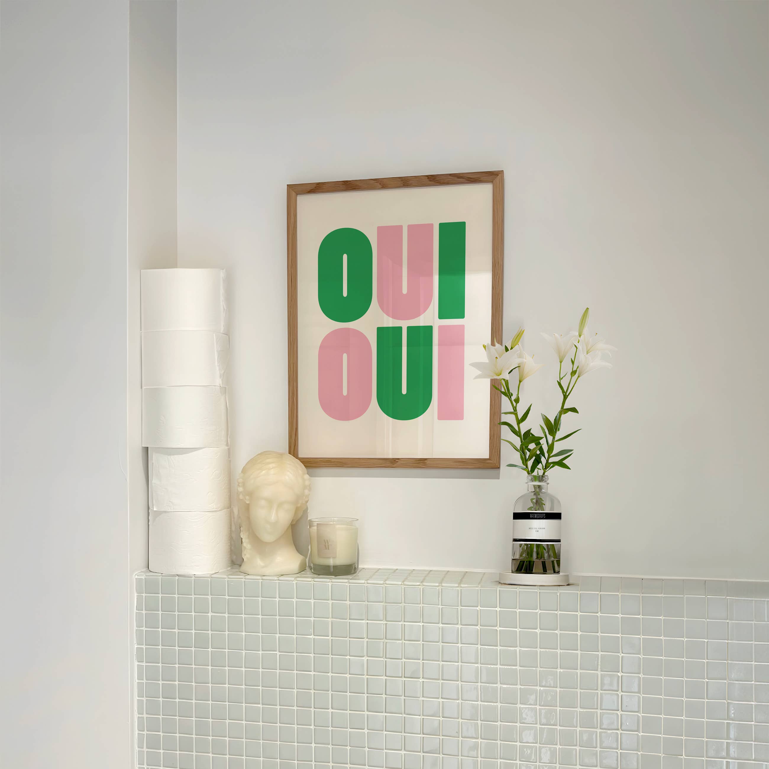 Say it twice with this bold Oui Oui art print. Pink and green text on a clean neutral background adds playful charm to any bathroom or gallery wall.