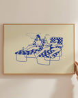 This piece of art feels like a mini-vacation. This unframed art print captures a delightful moment of two ladies basking in the sun by the pool, sipping cocktails and wine. With a soft butter yellow background and dark blue line drawing, it's a wonderfully relaxing piece of wall art that brings a touch of summer fun to any home decor collection.
