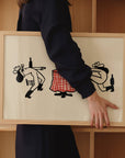 This unframed art print offers a fun twist on the classic duel, featuring two cowgirls in a standoff for the final bottle of wine. It's a fantastic, witty piece of vintage inspired western home decor that's ideal for kitchens, dining areas, or any space that needs a touch of playful personality.