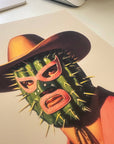 Retro cowboy in a cactus lucha libre mask, printed on archival matte paper. 8x10" bold art perfect for modern, maximalist, or western-inspired decor.