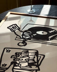 This piece of art celebrates the perfect night in. This unframed art print is a charming illustration of the ultimate combination: wine and vinyl. With its scribbley line texture, it has a wonderfully relaxed feel and modern aesthetic that’s a perfect addition to a living room, bar cart, or cozy reading nook. Perfect for wine lovers and foodies.