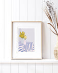 Cheerful yellow flowers in striped vases add modern charm to your space! This bold, colorful print brings a bright, happy vibe to any room