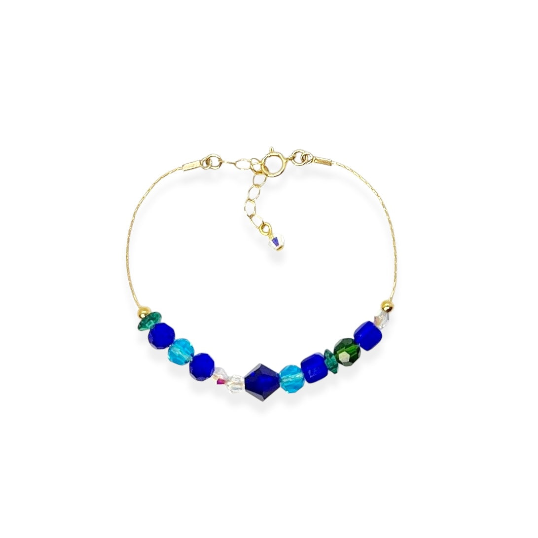 The Beaded Crystal Bracelet is a vibrant celebration of connection and joy, designed to brighten your day and remind you of the bonds that matter most. Crafted with 14k gold-filled components and vibrant, high-quality crystals, it adds a cheerful pop of color to your wrist. The unique adjustable design lets you either let the beads move freely along the bracelet or cinch them together for a perfectly centered look.