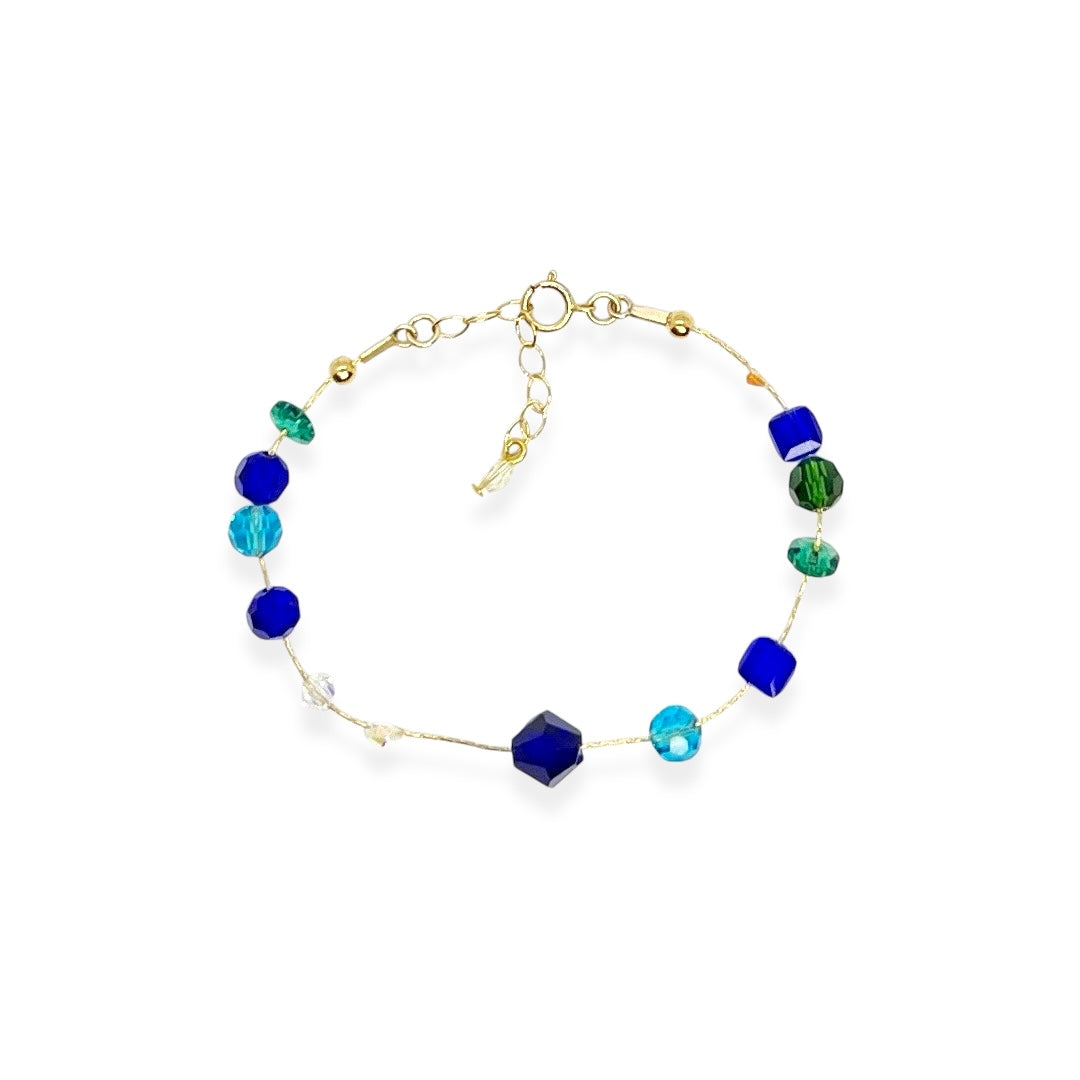 The Beaded Crystal Bracelet is a vibrant celebration of connection and joy, designed to brighten your day and remind you of the bonds that matter most. Crafted with 14k gold-filled components and vibrant, high-quality crystals, it adds a cheerful pop of color to your wrist. The unique adjustable design lets you either let the beads move freely along the bracelet or cinch them together for a perfectly centered look.