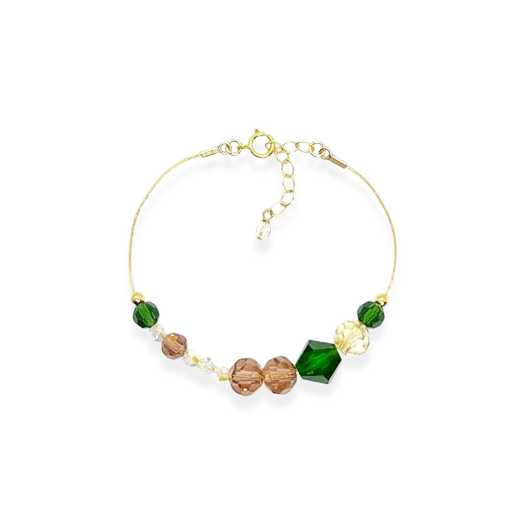 The Beaded Crystal Bracelet is a vibrant celebration of connection and joy, designed to brighten your day and remind you of the bonds that matter most. Crafted with 14k gold-filled components and vibrant, high-quality crystals, it adds a cheerful pop of color to your wrist. The unique adjustable design lets you either let the beads move freely along the bracelet or cinch them together for a perfectly centered look.
