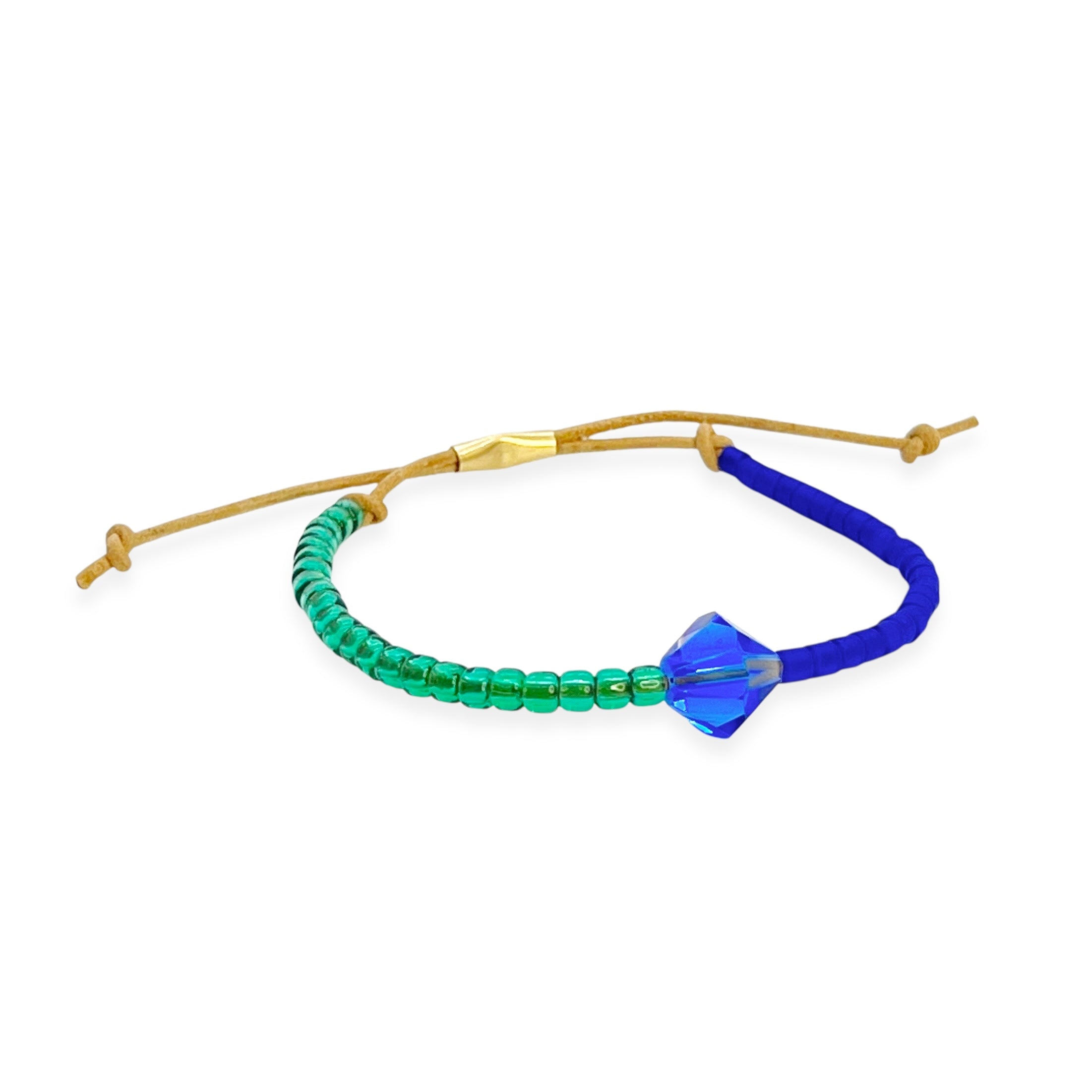 Grounded in natural beauty with a flash of brilliance, the Leather Bracelet brings texture and color together in one thoughtful design. Japanese glass beads are handwoven onto a supple leather band, accented with a singular hand-cut crystal and finished with a 14k gold-filled sliding clasp.