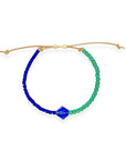 Grounded in natural beauty with a flash of brilliance, the Leather Bracelet brings texture and color together in one thoughtful design. Japanese glass beads are handwoven onto a supple leather band, accented with a singular hand-cut crystal and finished with a 14k gold-filled sliding clasp.