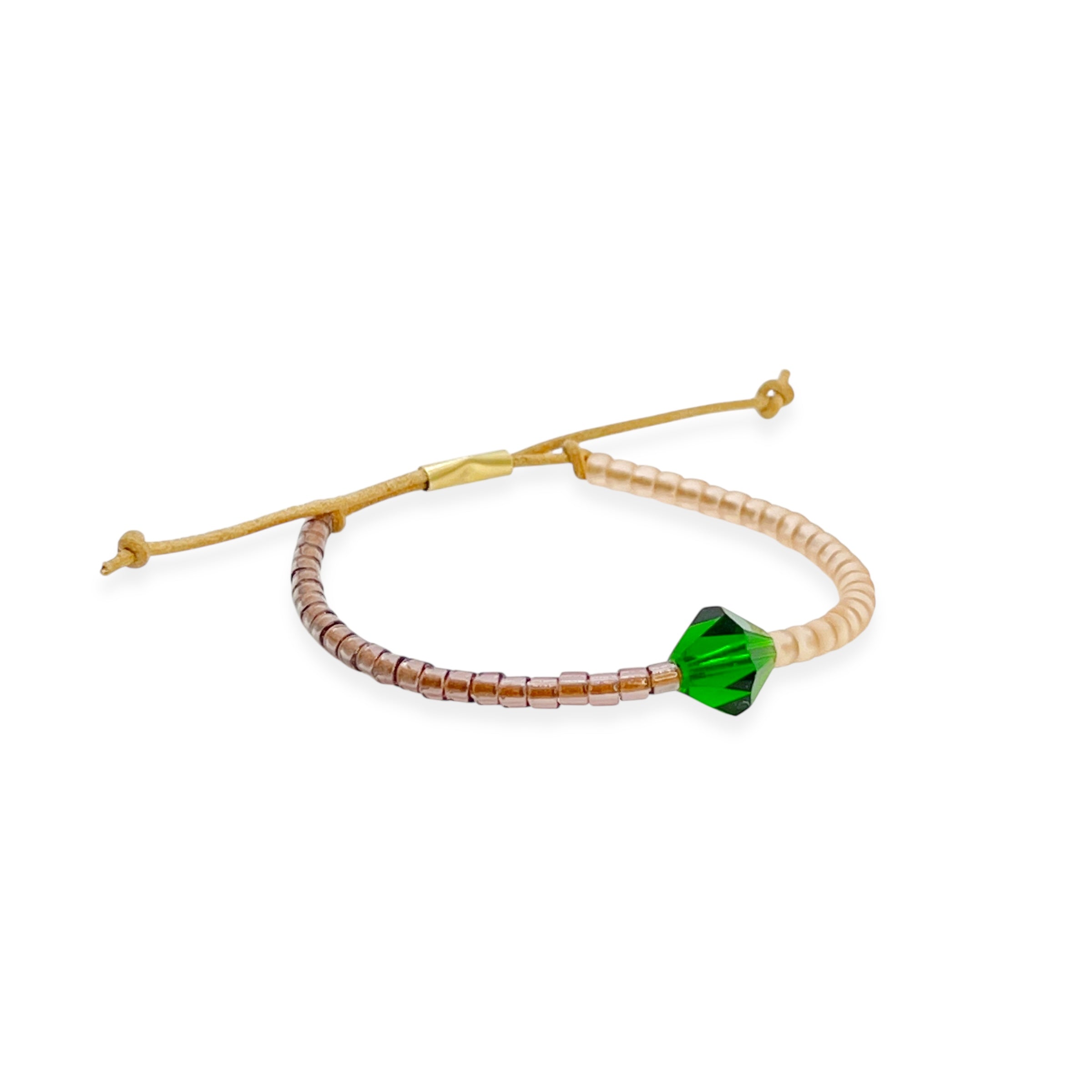 Grounded in natural beauty with a flash of brilliance, the Leather Bracelet brings texture and color together in one thoughtful design. Japanese glass beads are handwoven onto a supple leather band, accented with a singular hand-cut crystal and finished with a 14k gold-filled sliding clasp.