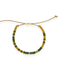 Part of our nostalgic friendship bracelet collection, this version features beautifully crafted Japanese glass beads strung on durable, comfortable cord and finished with a 14k gold-filled sliding clasp. It offers the same unisexy, elevated take on throwback style, perfect for stacking or wearing solo.