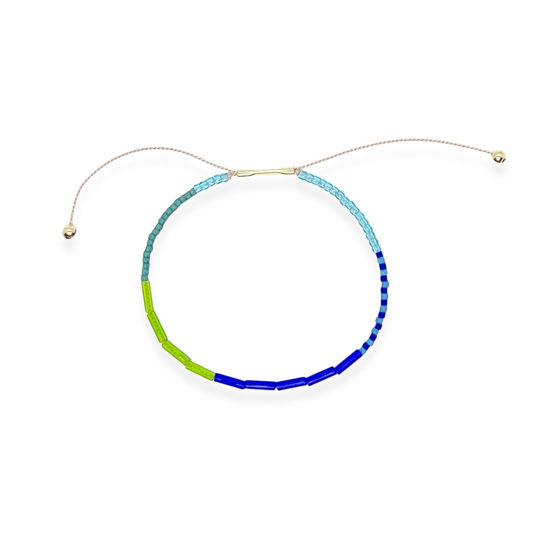 Soft, colorful, and effortlessly cool, the Beaded Silk Bracelet is made for everyday wear with a touch of sparkle. An adjustable silk cord is paired with glass beads and a 14k gold-filled clasp to create a piece that fits like a charm. Stack a few or wear one proudly in your favorite color.