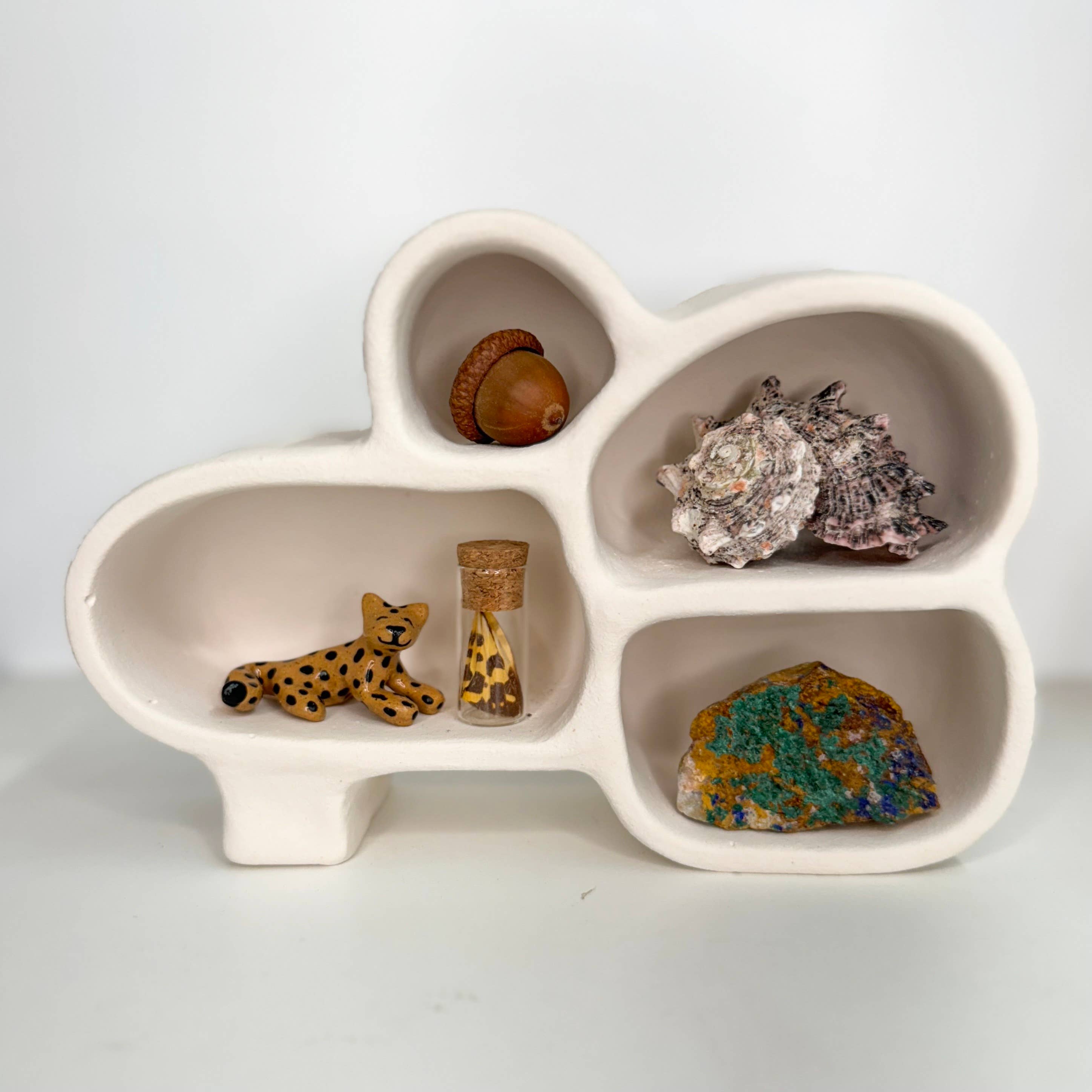 Handmade Cave of Inspiration shelf by The Minimalist Ceramist. Perfect for displaying crystals, rocks, air plants, and nature treasures.