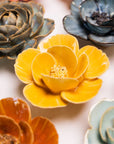 Bring everlasting blooms into your space with ceramic flowers—beautiful, handmade pieces that add a touch of nature-inspired charm without the upkeep. Each flower comes packaged in a lovely gift box and features a keyhole back, so you can display it on a wall or style it on a tabletop. Perfect for creating a blooming statement that never fades.