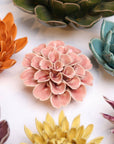 Bring everlasting blooms into your space with ceramic flowers—beautiful, handmade pieces that add a touch of nature-inspired charm without the upkeep. Each flower comes packaged in a lovely gift box and features a keyhole back, so you can display it on a wall or style it on a tabletop. Perfect for creating a blooming statement that never fades.