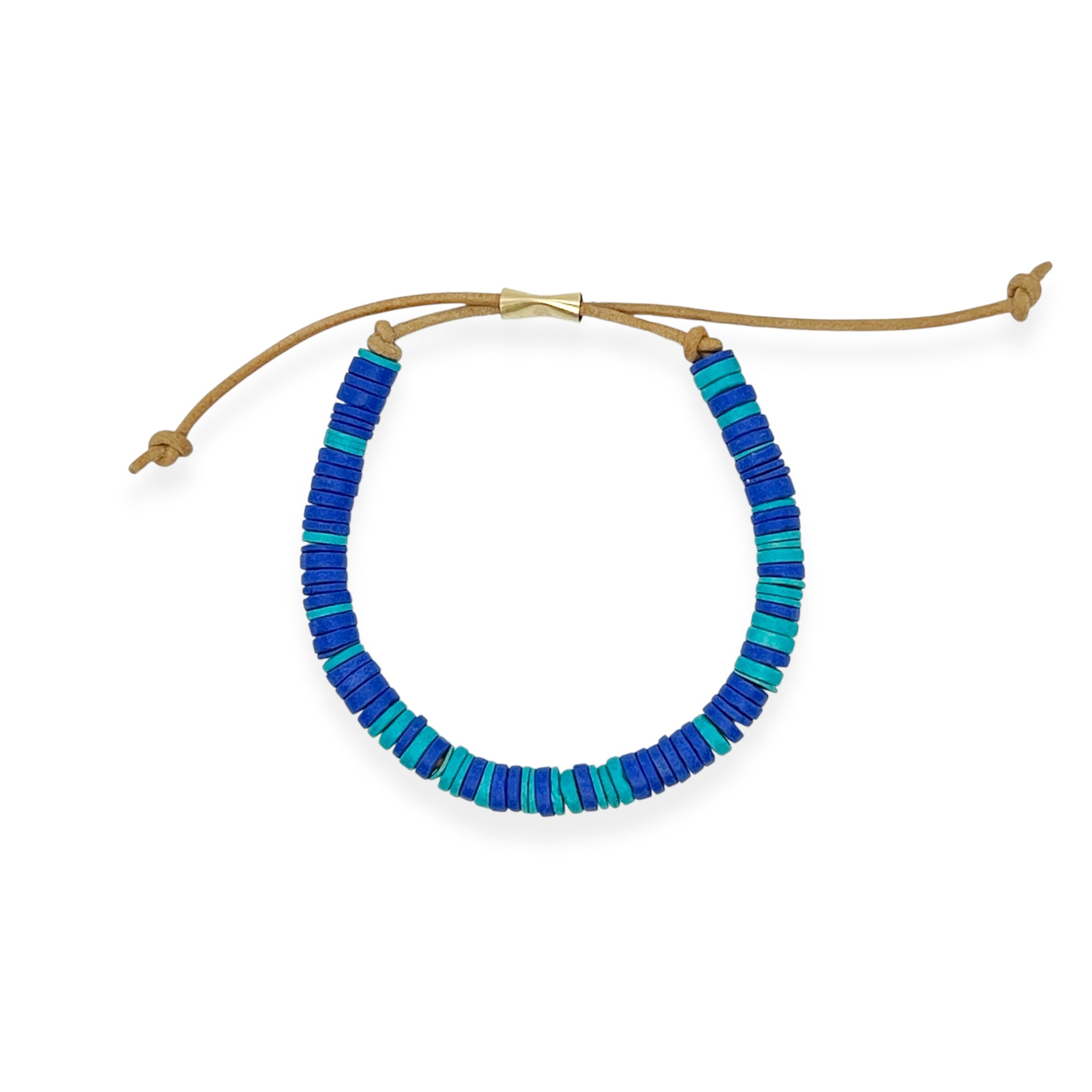Our ceramic leather beaded bracelet is a grown-up take on the classic friendship bracelet — made for your inner 90s kid with a modern, unisexy edge. Each bracelet is hand-strung with richly glazed ceramic beads and finished with supple leather cord and a 14k gold-filled sliding clasp, creating an effortless mix of earthy texture, graphic punch, and elegant wearability.