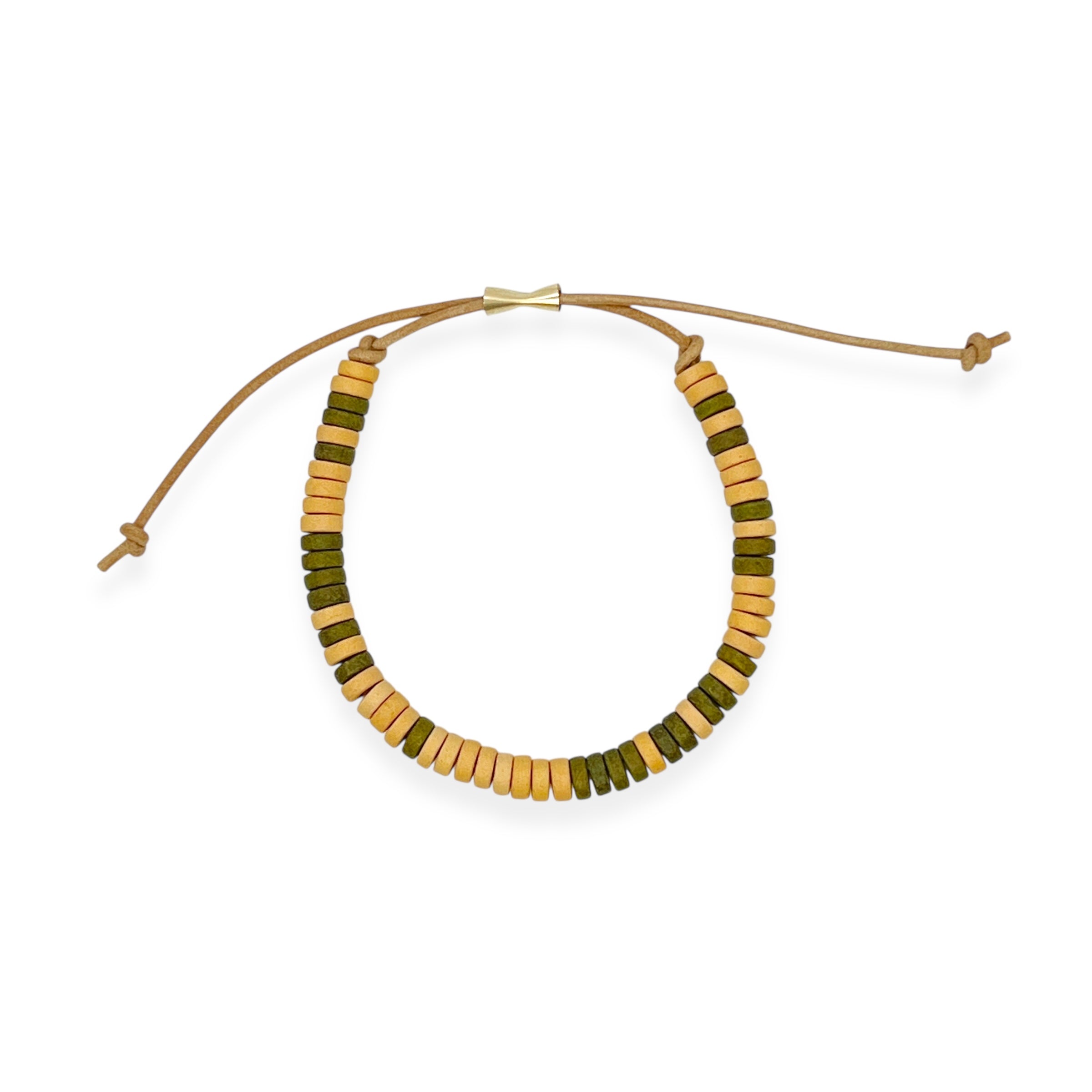 Our ceramic leather beaded bracelet is a grown-up take on the classic friendship bracelet — made for your inner 90s kid with a modern, unisexy edge. Each bracelet is hand-strung with richly glazed ceramic beads and finished with supple leather cord and a 14k gold-filled sliding clasp, creating an effortless mix of earthy texture, graphic punch, and elegant wearability.