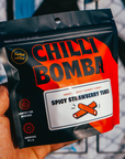 Spicy Strawberry Tubes filled with vanilla and coated in chamoy chili. Sweet, sour, and spicy candy with bold flavor. Made fresh weekly in the USA.