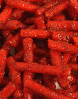 Spicy Strawberry Tubes filled with vanilla and coated in chamoy chili. Sweet, sour, and spicy candy with bold flavor. Made fresh weekly in the USA.