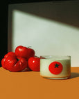 Capture garden-fresh vibes with this Tomato Candle—earthy, vibrant notes of tomato vines, arugula, lemon zest & thyme. Made by Fresa Creative, a Latina-owned brand.