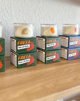 Capture garden-fresh vibes with this Tomato Candle—earthy, vibrant notes of tomato vines, arugula, lemon zest & thyme. Made by Fresa Creative, a Latina-owned brand.