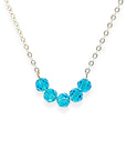 The Crystal Arc Necklace brings a playful twist to a minimal silhouette. Featuring a smooth, curved, colorful crystal arc, it’s designed to rest beautifully along your neckline. This piece adds an effortless pop of color that’s perfect for layering or wearing solo when you want a simple statement.