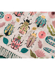 Add charm and protection to your kitchen with the Amulet Embroidered Dishtowel. Featuring insects, reptiles, flowers, and feathers in vibrant hues with playful tassels.