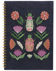 Empower your dreams with the Amulet Embroidered Notebook, featuring protective symbols and high-quality screen printing in a striking ring-bound design.