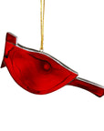 Made of semi-translucent red glass, this cardinal fire bird ornament can be used as a Christmas decoration, or a year-round accent. It hangs beautifully in a window, catching the sunlight, adding a charming quality to any space. 