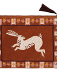 Tucked in a tote or at hand on the vanity, this pouch with embroidered design and tassel detail give everyday routines a beautiful boost. Detailed borders outline this creature's story with an intricate, tile-like frame. Follow the hare into a land where imagination wanders and worldly wisdom is shared through tales as old as time with this design from the Folktale Collection.