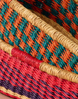 Add these bright, handcrafted baskets to your table, shelf or closet - the uses are limited only by your imagination! Gorgeously handwoven from locally sourced veta vera grass, the utilitarian design features an assortment of vibrant colors. Each one is woven while wet and can be re-shaped by adding water, perfect for the kitchen and bath! Durable and washable, these baskets are a beautiful and unique addition to any decor. 