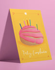 This colorful birthday card features a perfect pink concha adorned with birthday candles. Celebrate Hispanic Heritage Month with Ana Peake's Spanish Greeting Cards, adorned with stunning Mexican Folk Art Inspired Illustrations! These beautifully designed cards, perfect for honoring Hispanic heritage and spreading joy on special occasions.