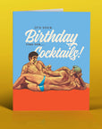 Birthday card with two men lounging on a beach and text 'It's your birthday time for cocktails!' on a yellow background.