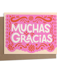 Say thanks with Ana Peake’s “Papel Picado” Greeting Card, featuring a vibrant pink design inspired by traditional Mexican folk art. Perfect for festively expressing gratitude.