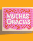 Say thanks with Ana Peake’s “Papel Picado” Greeting Card, featuring a vibrant pink design inspired by traditional Mexican folk art. Perfect for festively expressing gratitude.