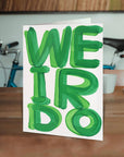 Celebrate the wonderfully strange with our Weirdo Greeting Card, featuring the unmistakably quirky artwork of David Shrigley. Perfect for birthdays, everyday laughs, or sending a little oddball joy, this card is blank inside so you can craft your own message—or let the weirdness speak for itself.