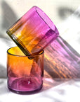 This vibrant, ombré pink and orange tumbler is hand blown in a family-run workshop, making each piece truly one-of-a-kind. Subtle variations in size and color mean no two are alike. Perfect for wine, cocktails, or even as a charming candle holder, it brings a touch of artistry and personality to any table.