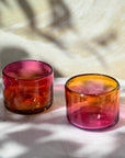 This vibrant, ombré pink and orange tumbler is hand blown in a family-run workshop, making each piece truly one-of-a-kind. Subtle variations in size and color mean no two are alike. Perfect for wine, cocktails, or even as a charming candle holder, it brings a touch of artistry and personality to any table.
