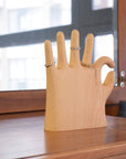 Show off your rings, necklaces, and bracelets with a touch of whimsy. This beech wood jewelry display features a hand making the classic “OK” sign with a playful twist: one extra finger (6 in total) to hold even more of your favorite pieces. Perfect for keeping your jewelry organized and adding a fun, eye-catching accent to your dresser or vanity.