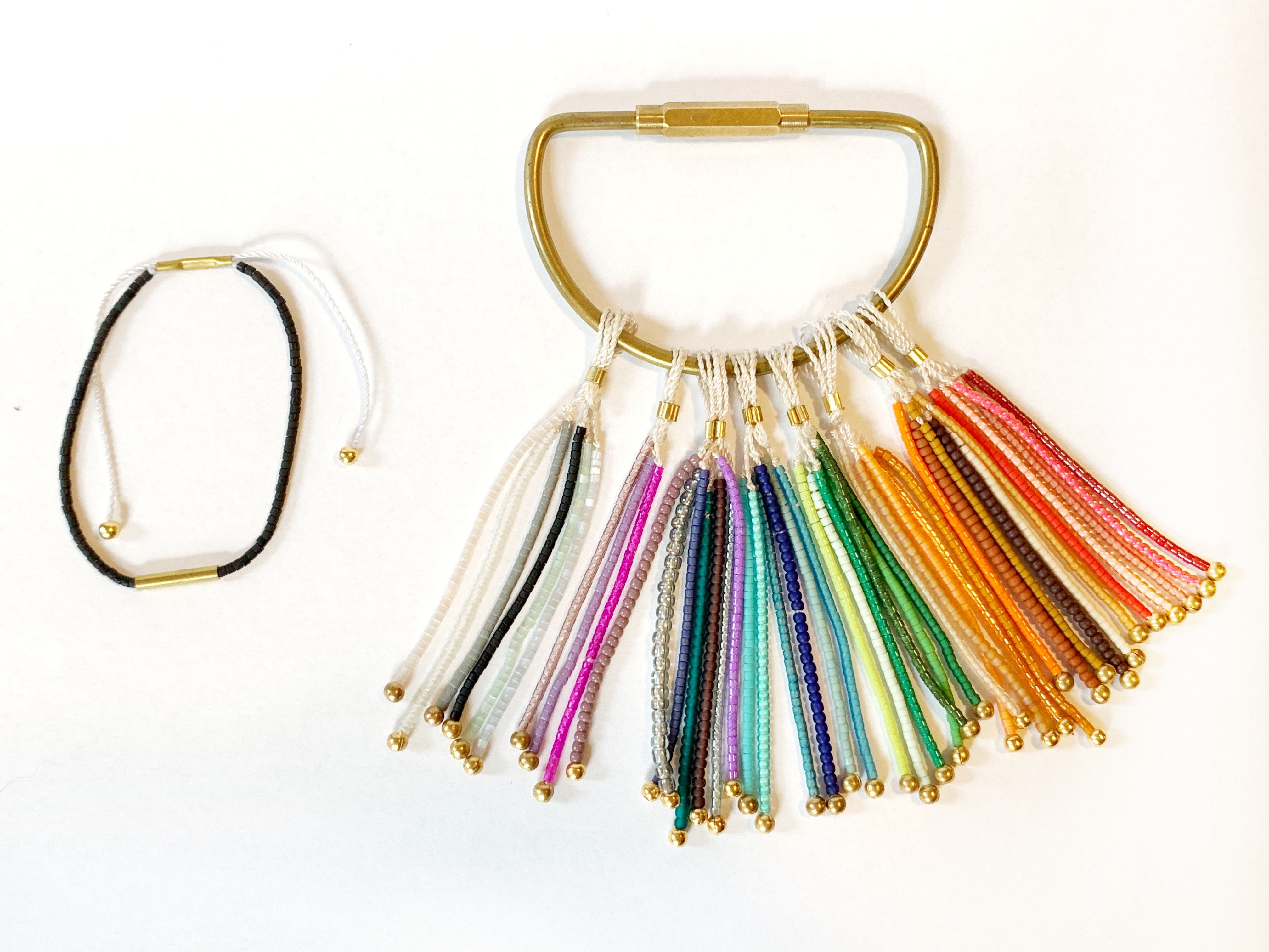 Pick your perfect color.
The Irena Bracelet is made to order in your choice of color from a wide selection of solid hues. It’s an easy way to create something just for you.
Each bracelet is handcrafted with beautiful Japanese glass beads on an adjustable cord that comfortably fits most wrists. You can choose from three metal finishes: 14k gold-filled with silk cord, sterling silver with silk cord, or brass with nylon cord. The Irena is simple, stackable, and uniquely yours.