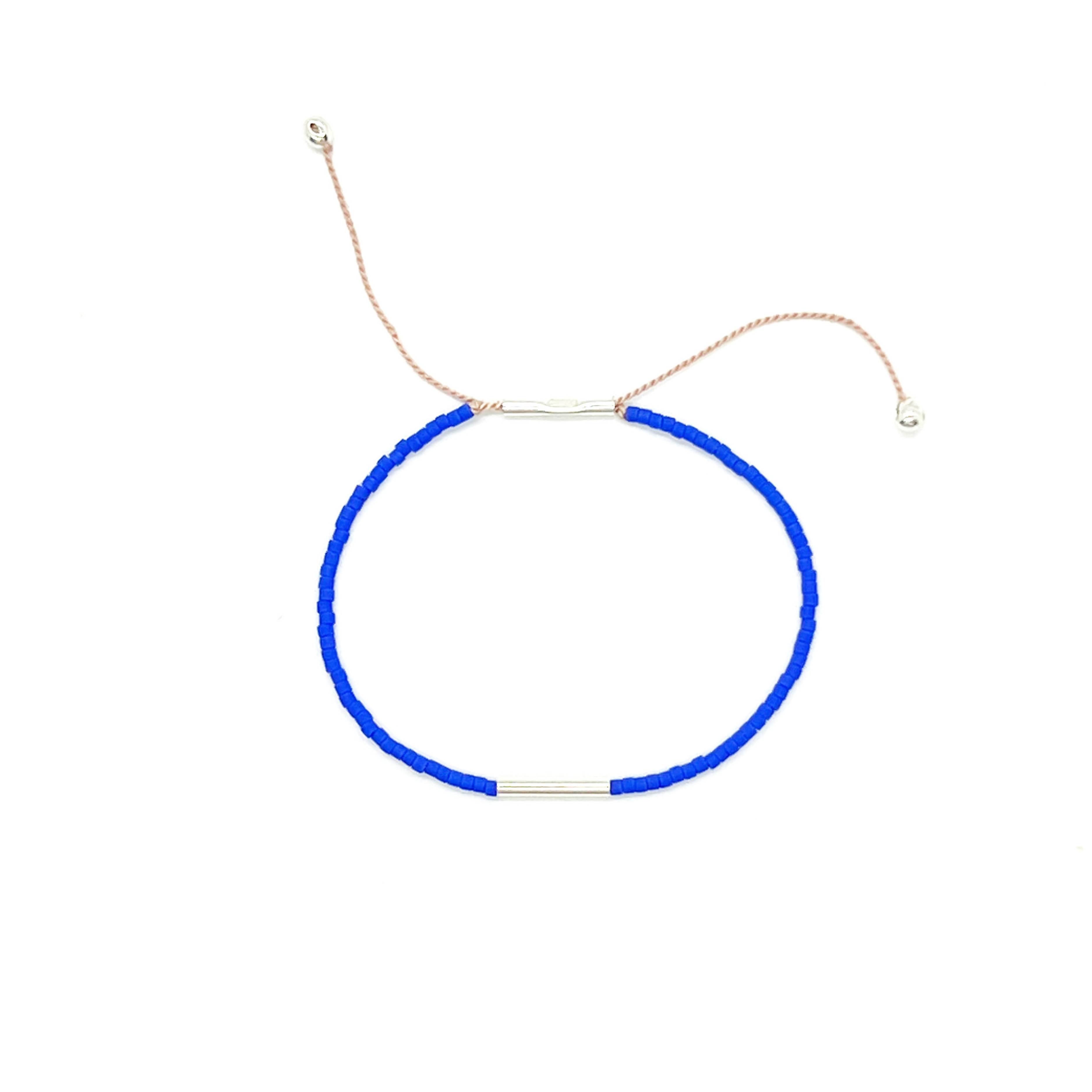 Pick your perfect color.
The Irena Bracelet is made to order in your choice of color from a wide selection of solid hues. It’s an easy way to create something just for you.
Each bracelet is handcrafted with beautiful Japanese glass beads on an adjustable cord that comfortably fits most wrists. You can choose from three metal finishes: 14k gold-filled with silk cord, sterling silver with silk cord, or brass with nylon cord. The Irena is simple, stackable, and uniquely yours.
