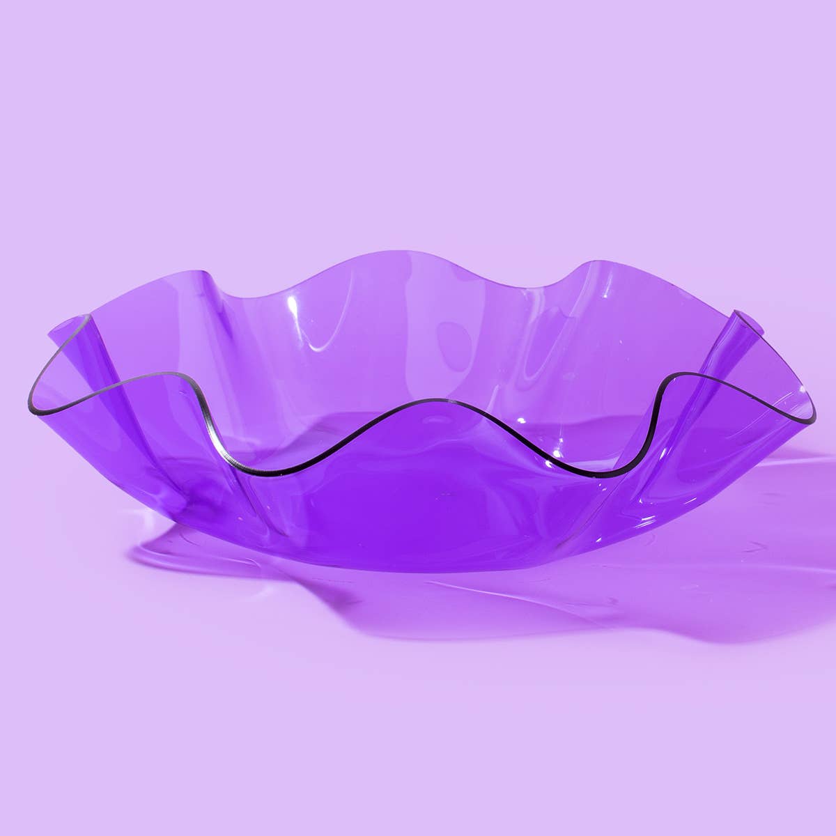 Add a playful pop to any space with this medium wavy acrylic bowl in vibrant purple! Great for corralling small items or adding color to a shelf, this bowl is as functional as it is fun. Mix and match with other sizes and colors for a bold, layered look that stands out.