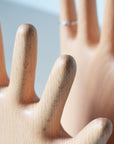 Keep your rings, necklaces, and bracelets organized with a fun twist. This beech wood jewelry display features a regular hand with one extra finger, giving you six spots to hang all your favorite pieces. Perfect for adding a whimsical and functional accent to your dresser or vanity.