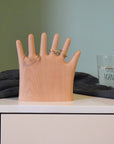 Keep your rings, necklaces, and bracelets organized with a fun twist. This beech wood jewelry display features a regular hand with one extra finger, giving you six spots to hang all your favorite pieces. Perfect for adding a whimsical and functional accent to your dresser or vanity.